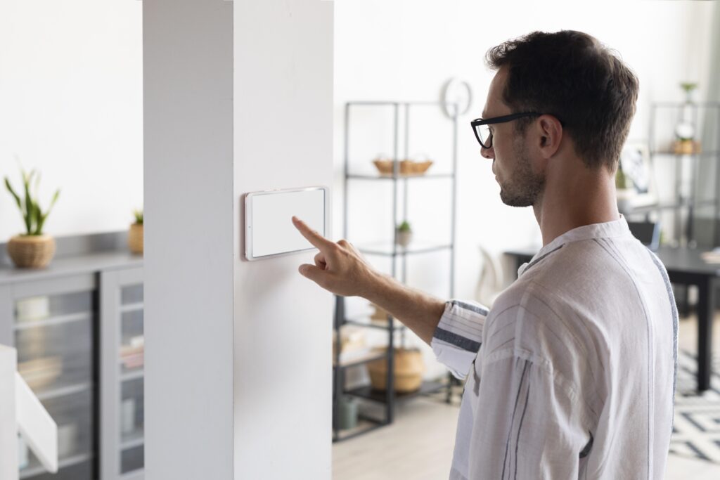 man using tablet his smart home