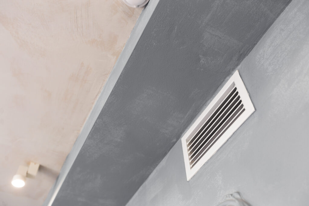 Preparing for Spring with Clean HVAC Ducts to Tackle Allergy Season 1 Air Condition Circular Ventilation Duct indoors on the wall
