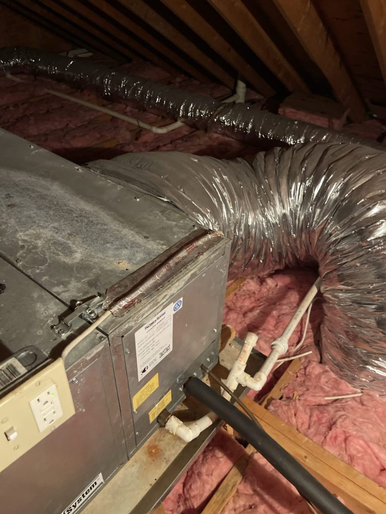 HVAC & Plumbing in Franklin, MA 13 Old Unico small-duct air handler in a Franklin, MA attic before replacement