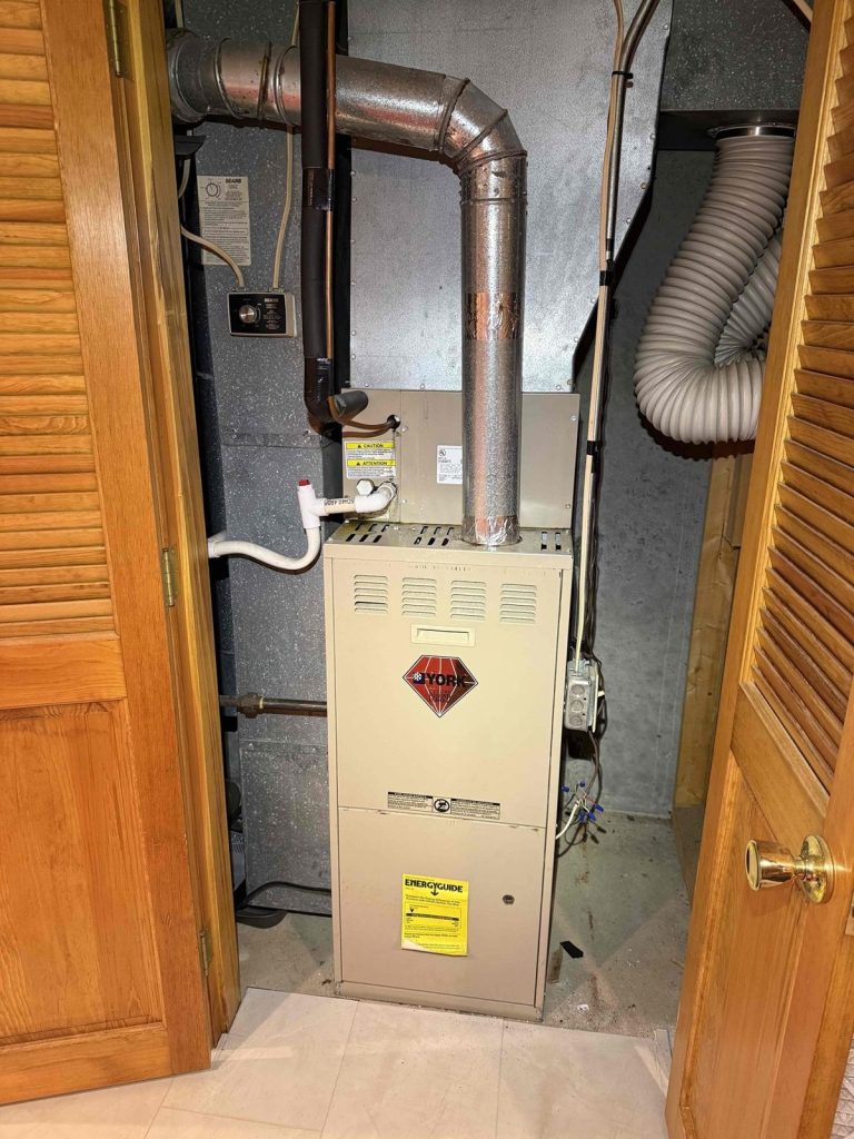 HVAC & Plumbing in Franklin, MA 15 Aging gas furnace in a Franklin, MA basement before replacement