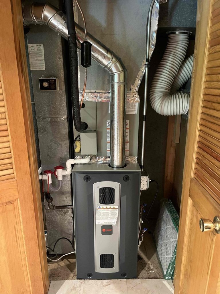 HVAC & Plumbing in Franklin, MA 16 New two-stage Trane gas furnace installed in a Franklin, MA basement