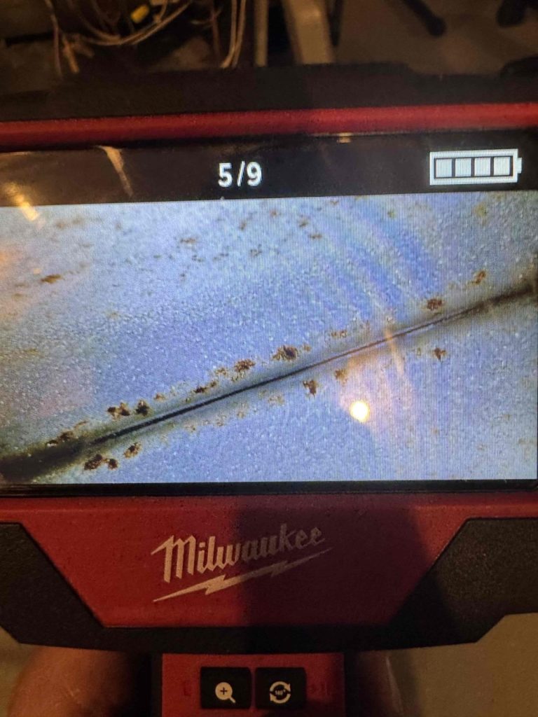 HVAC & Plumbing in Medway, MA 11 Camera view of pinholes in a furnace heat exchanger tube in Medway, MA