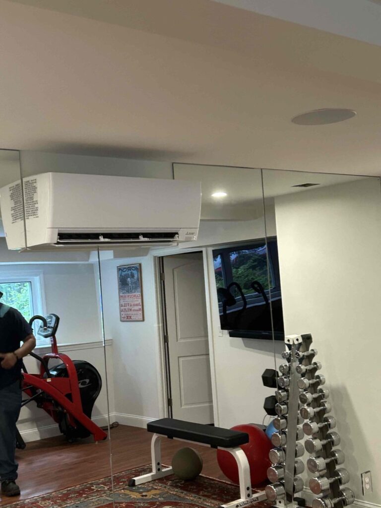 HVAC & Plumbing in Norfolk, MA 12 Mitsubishi wall unit in a Norfolk, MA home gym